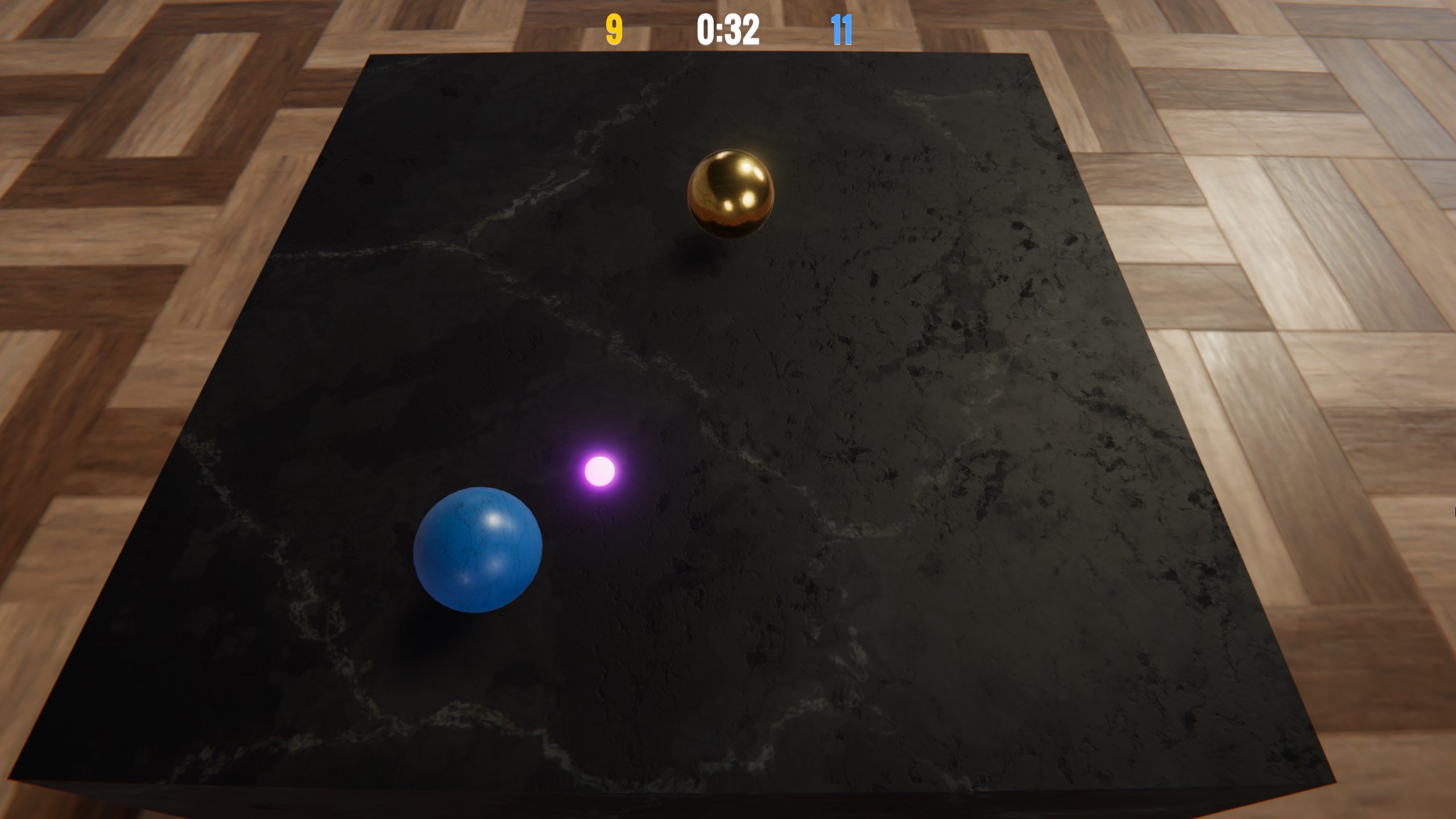 Screenshot of the game featured in the course Unity for Web Developers. It shows a marble countertop with two metal spheres rolling around on top.